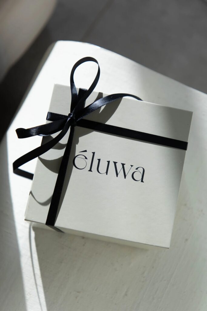 Éluwa gift box tied with a black ribbon